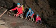 Climbing upwards to a new level of the old Welsh slate mine with Corris Mine Explorers on a Maxi Mine Explorer trip.