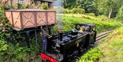 Locomotive no. 8 'Llewellyn' passes a water tank near to Devil's Bridge station
