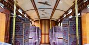 The plush interior and hand painted ceilings of the First Class carriages