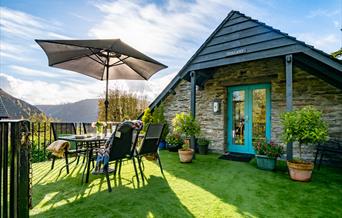 The garden deck outside Tollant with views over the hills and meadows.