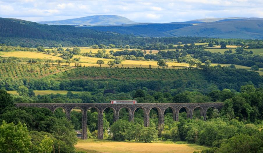Train Passing over Cynghordy Viaduct with the Western Brecon Beacons in the distance Train Passing over Cynghordy Viaduct with the Western Brecon Beacons in the distance