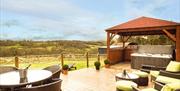 Decking area and hot tub at Cwmcelyn luxury self catering