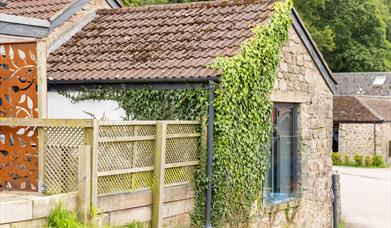 The rustic ivy-covered exterior of the Blorenge cottage