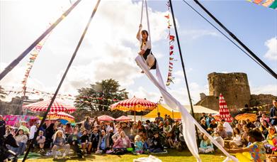 Circus performer in Caldicot Castle at Big Banquet 