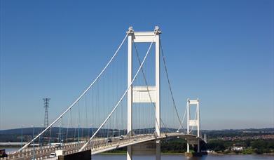 Severn Bridge, older of the two bridges, show against a blue sky 