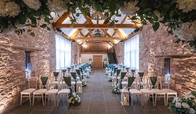 Oaklands Barn Weddings venue - beautiful barn with flowers