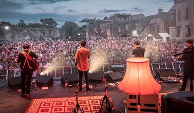 rusty shackle live at caldicot castle crowd and castle in background
