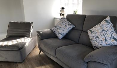 A cosy two-seater sofa and mini chaise longue in the Blorenge lounge