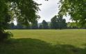 Chippenham fields in monmouth showing open park with green grass, mature beautiful trees and sunny day