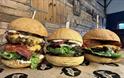 Pig and apple burgers looking very tasty in rustic restaurant