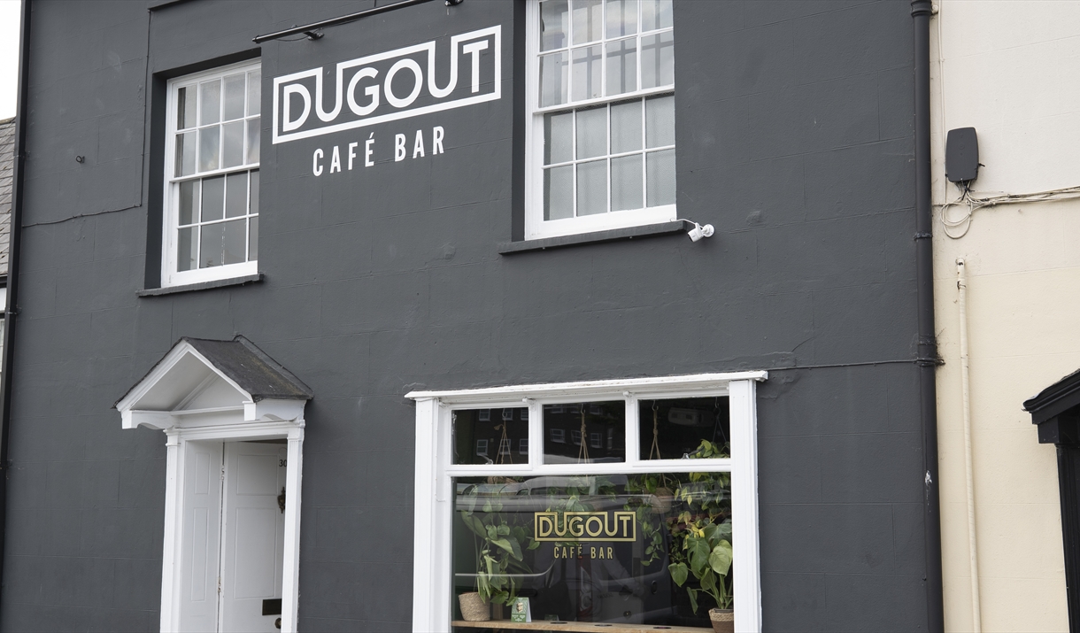 The Dugout Café bar
outside dark grey building with white windows