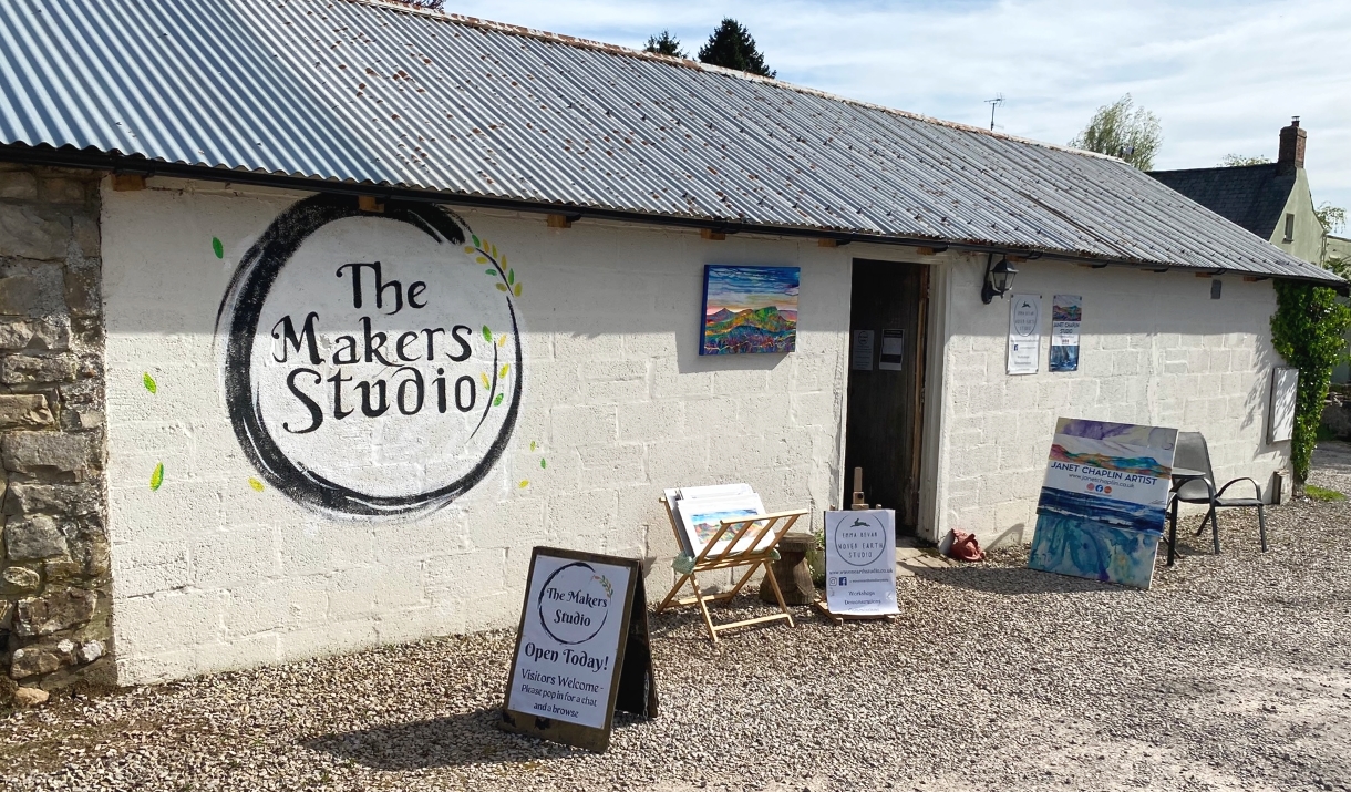 quant brick barn with The makers studio sign on the side, art work