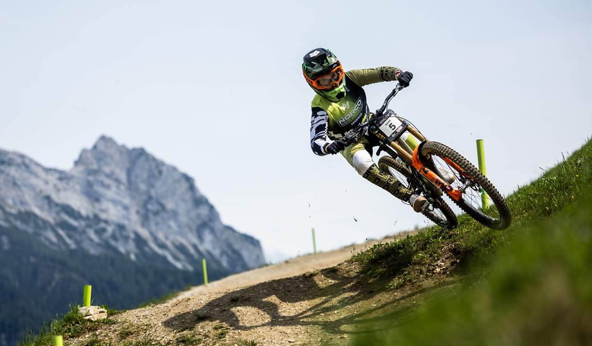 Down hill mountain biker riding down hill