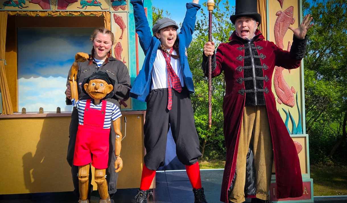 actors cheer and be silly for crowd at Abergavenny castle open air theatre