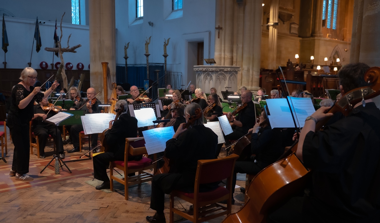 orchestra performs in church