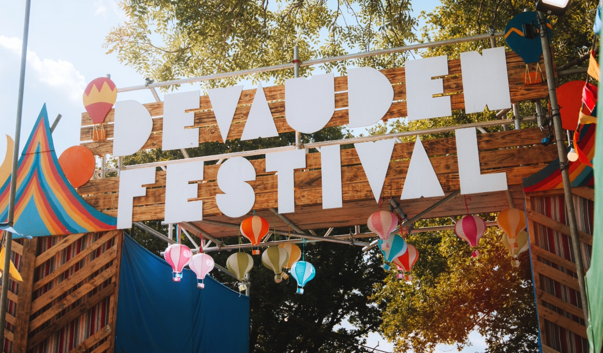 Devauden Music Festival 2025  gate with sign with bright colours and balloons in Monmouth