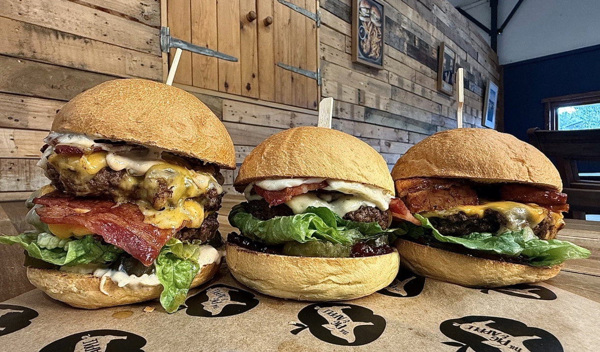 Pig and apple burgers looking very tasty in rustic restaurant