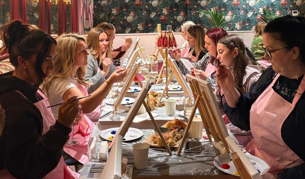 Sip and Paint Abergavenny Pugh's Garden Kitchen abergavenny people paint in a restaurant whilst enjoying a drink