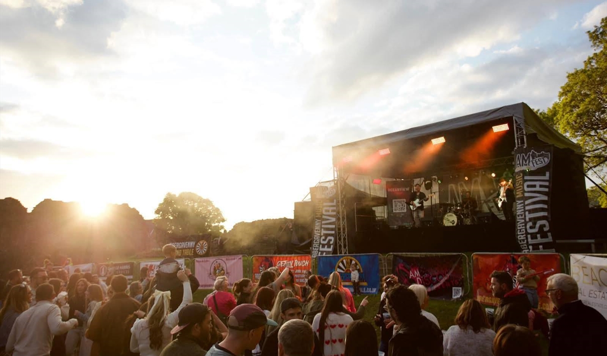 Abergavenny music festival in Abergavenny Castle night scene with band and crowd