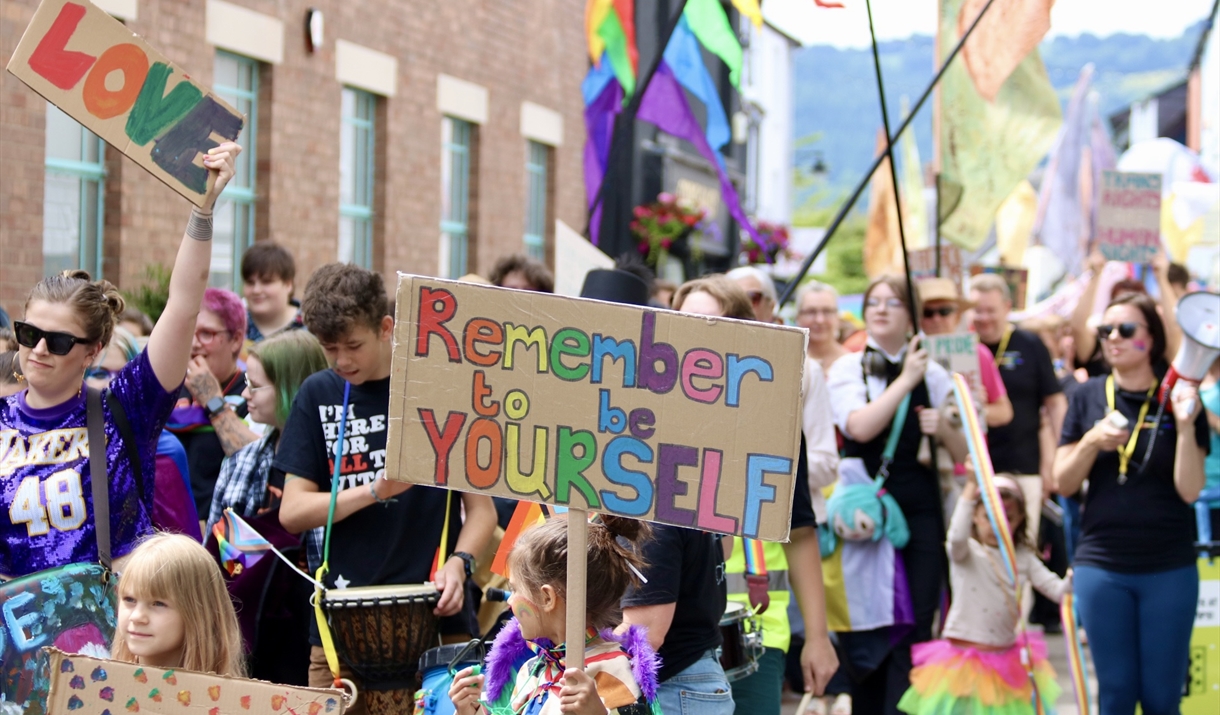 image of happiness and love at Abergavenny Pride Parade 2024, bright colours, celebration, diversity