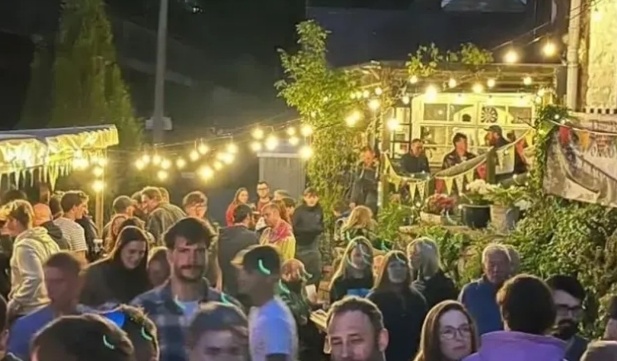 The Boat inn Penallt evening night scene people drinking outside with lights and party atmosphere in monmouth