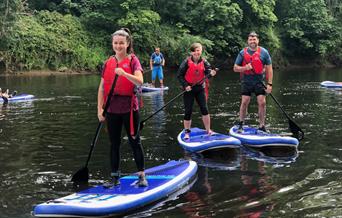 Stand-up paddleboarding on the River Wye in the Wye Valley Monmouthshire Wales for all, families, friends & team building days out.