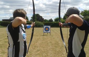 2 people shooting bows