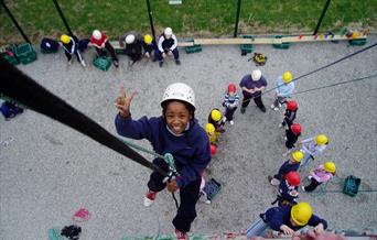 Abseiling off wall