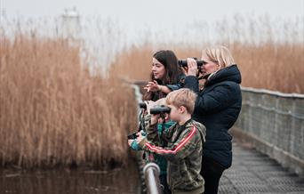 Family on a bridge -  Image credit: Dakeney Fox Photography