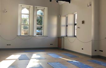 Yoga mats in front of church windows