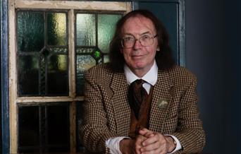 Professor Hutton sat at Table