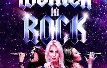 The Women in Rock singing and pointing.