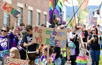 image of happiness and love at Abergavenny Pride Parade 2024, bright colours, celebration, diversity