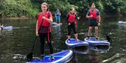 Stand-up paddleboarding on the River Wye in the Wye Valley Monmouthshire Wales for all, families, friends & team building days out.