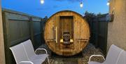 Evening view of beautiful Red Cedar Barrel Sauna which is for Blackthorn Guests' use only. It is situated in a lockable private area which can also be