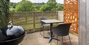 The Blorenge enclosed terrace with barbecue, table and two chairs, and privacy screen.