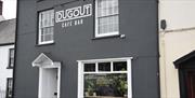 The Dugout Café bar
outside dark grey building with white windows