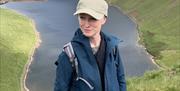 Adrienne Cradock Artist outside on mountain
