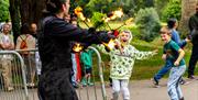children laugh with surprise at performer at Caldicot Castle