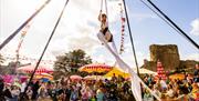 Circus performer in Caldicot Castle at Big Banquet
