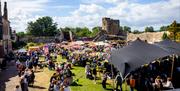 caldicot castle grounds with tents and people and flags