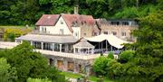 Caer Llan building with rural trees and stunning countryside in monmouthshire