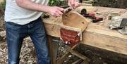 Stool making green woodwork course in woodlands near Usk Monmouthshire