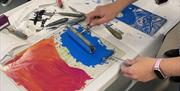 Lino printing close up of tools and equipemnt being used  in Abergavenny Llanfoist