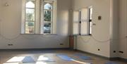 Yoga mats in front of church windows