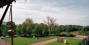 Llantilio House, Pentwyn Farm, Abergavenny gardens and games on lawn, rural landscape