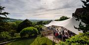 Martin Ellard Wedding photography captured wedding venue Caer Llan in monmouthhire with stunning gardens and marquee