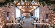 Oaklands Barn Weddings venue - beautiful barn with flowers