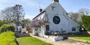 The Halfway at Tal-y-coed old fashioned pub white brick at the side of a country road with hedge in rural setting in monmouthshire