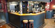 The Five Alls Inn inside pub showing blue bar